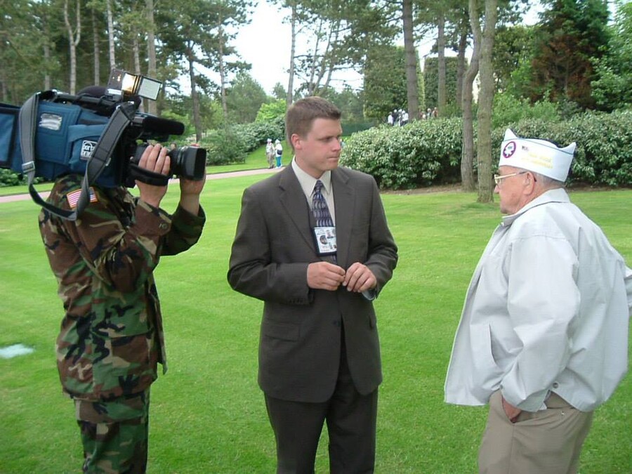 Kane Farabaugh interviewing a WWII veteran in Normandy, France